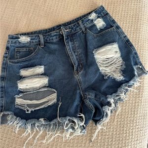 Ripped dark blue denim shorts